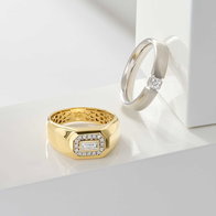 Men's yellow gold signet ring with baguette diamonds paired with a white gold diamond wedding band