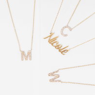Gold name necklaces and initial letter pendants with diamond accents on a white background.