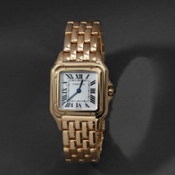 Gold square‑case watch with Roman numeral dial and link bracelet on dark background.